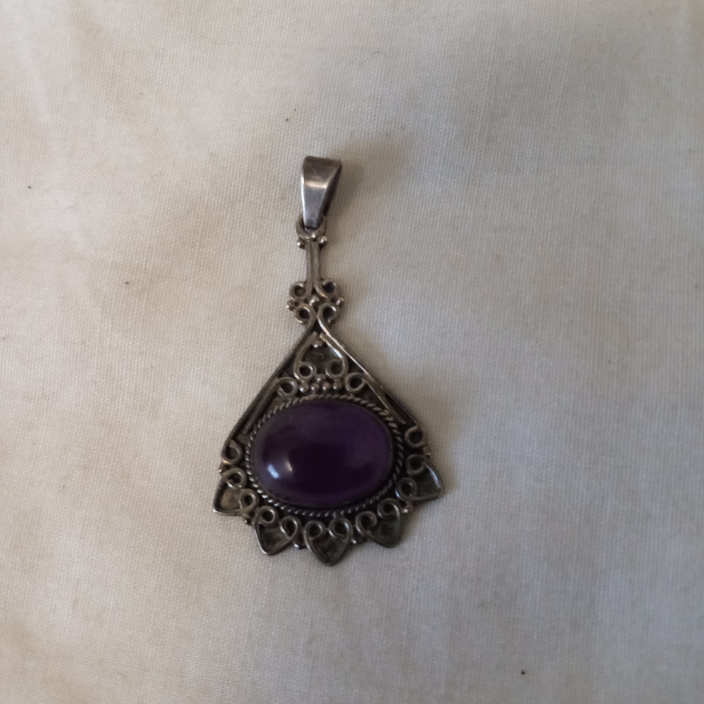 Elegant Silver Pendant with Purple Stone